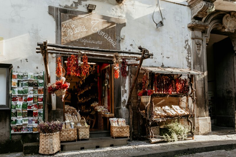 Small Italian market with products on both sides of the door